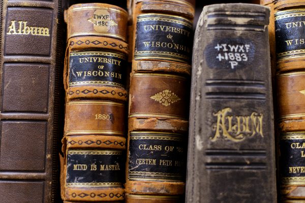 four old books on library shelf